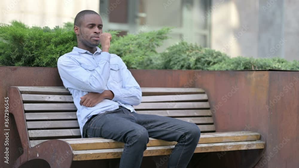 Sick Young African Man Coughing on Bench Outdoor Sick Young African Man Coughing on Bench Outdoor
