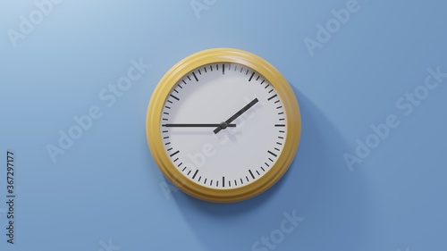 Glossy orange clock on a blue wall at quarter to two. Time is 01:45 or 13:45