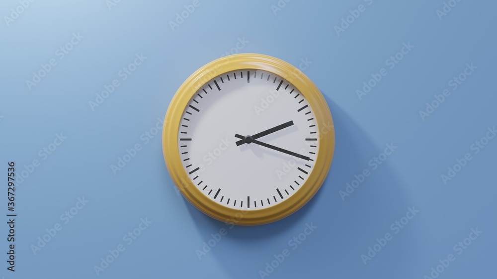 Glossy orange clock on a blue wall at eighteen past two. Time is 02:18 or 14:18 Glossy orange clock on a blue wall at eighteen past two. Time is 02:18 or 14:18