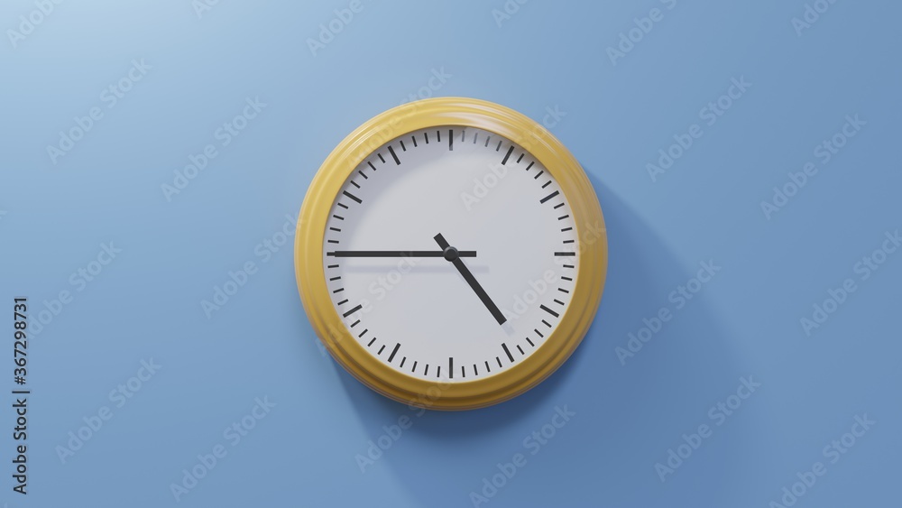 Glossy orange clock on a blue wall at quarter to five. Time is 04:45 or 16:45 Glossy orange clock on a blue wall at quarter to five. Time is 04:45 or 16:45