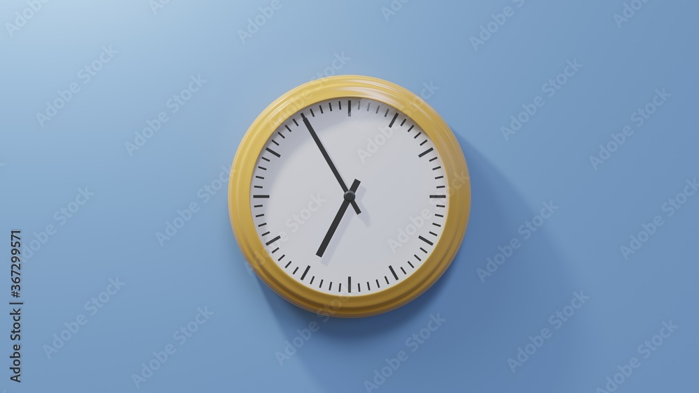 Glossy orange clock on a blue wall at five to seven. Time is 06:55 or 18:55