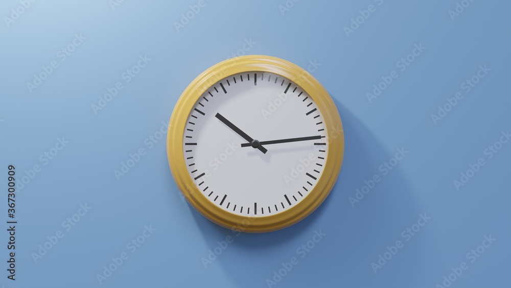 Glossy orange clock on a blue wall at fourteen past ten. Time is 10:14 or 22:14 Glossy orange clock on a blue wall at fourteen past ten. Time is 10:14 or 22:14