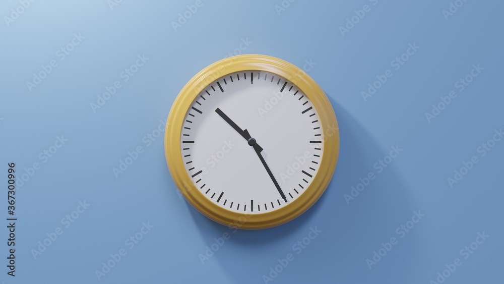 Glossy orange clock on a blue wall at twenty-five past ten. Time is 10:25 or 22:25 Glossy orange clock on a blue wall at twenty-five past ten. Time is 10:25 or 22:25