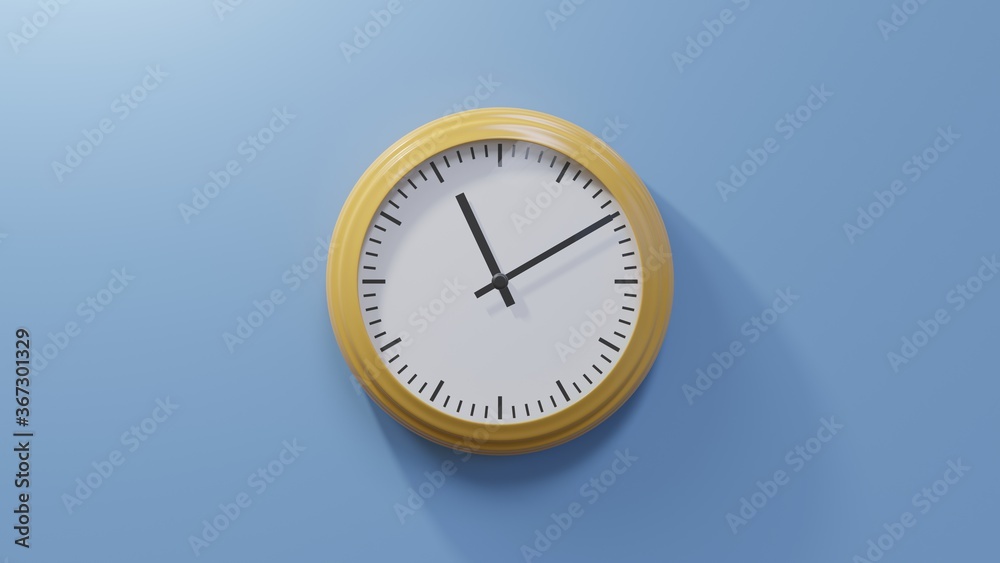 Glossy orange clock on a blue wall at ten past eleven. Time is 11:10 or 23:10 Glossy orange clock on a blue wall at ten past eleven. Time is 11:10 or 23:10