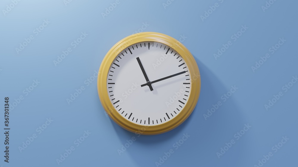 Glossy orange clock on a blue wall at twelve past eleven. Time is 11:12 or 23:12 Glossy orange clock on a blue wall at twelve past eleven. Time is 11:12 or 23:12