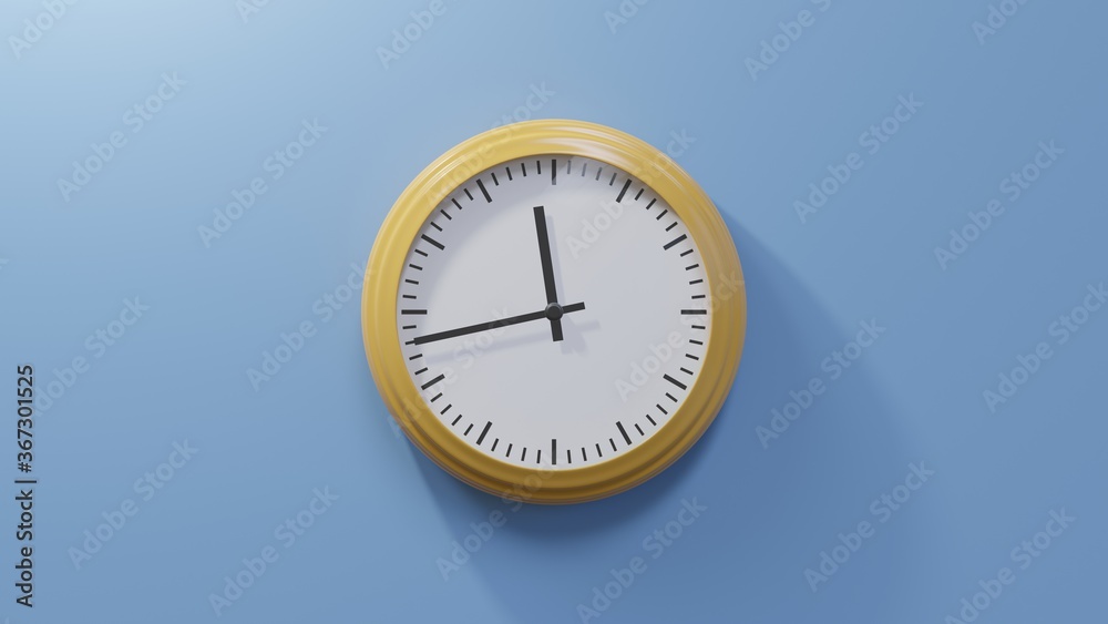 Glossy orange clock on a blue wall at forty-three past eleven. Time is 11:43 or 23:43 Glossy orange clock on a blue wall at forty-three past eleven. Time is 11:43 or 23:43