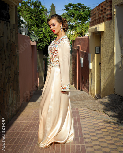 A girl in a Moroccan kaftan.