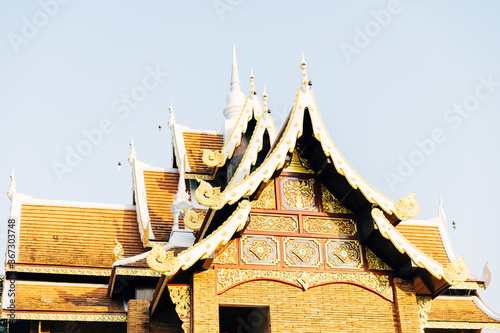 Quadro su tela Temple litten by the sun at the golden hour in Chiang Mai Thailand