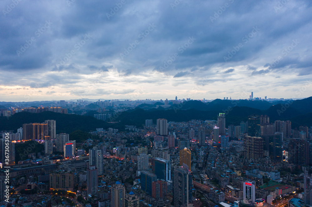 Aerial view of modern city and mountains