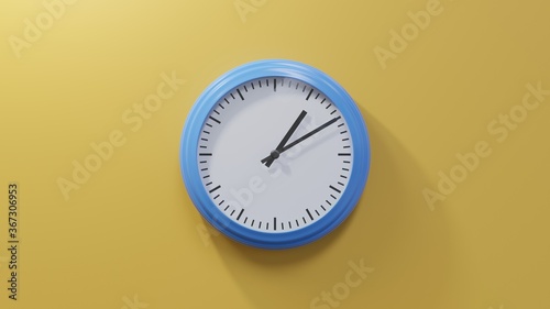 Glossy blue clock on a orange wall at ten past one. Time is 01:10 or 13:10