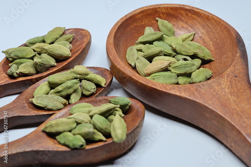 Green Dried cardamom seeds isolated on white background