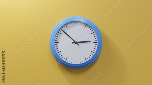 Glossy blue clock on a orange wall at fifty-two past two. Time is 02:52 or 14:52
