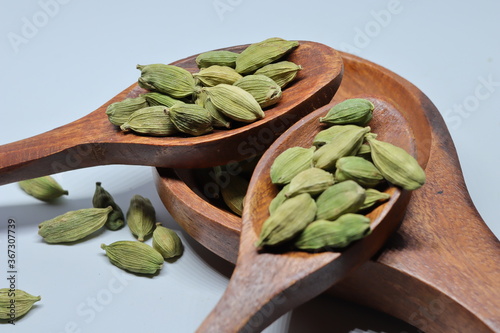 Green Dried cardamom seeds isolated on white background