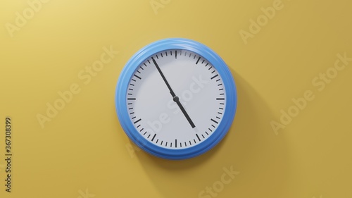 Glossy blue clock on a orange wall at five to five. Time is 04:55 or 16:55