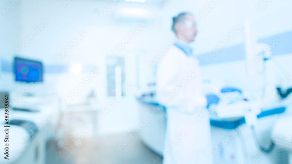Medical laboratory with analyzers and a medical worker, laboratory assistant. Blur abstract background Medical laboratory with analyzers and a medical worker, laboratory assistant. Blur abstract background