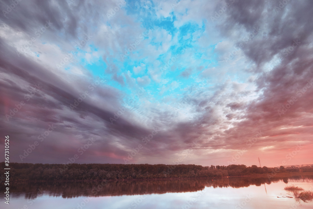 Beautiful and quiet river or lake and sunset sky. Fishing and natural attractions. Wide angle panoramic view Beautiful and quiet river or lake and sunset sky. Fishing and natural attractions. Wide angle panoramic view