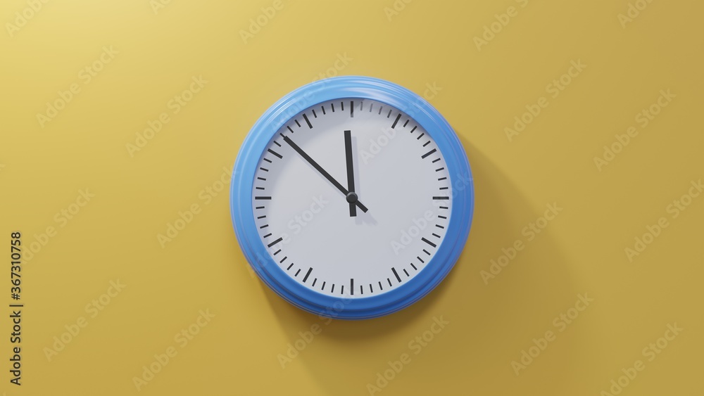 Glossy blue clock on a orange wall at fifty-two past eleven. Time is 11:52 or 23:52 Glossy blue clock on a orange wall at fifty-two past eleven. Time is 11:52 or 23:52