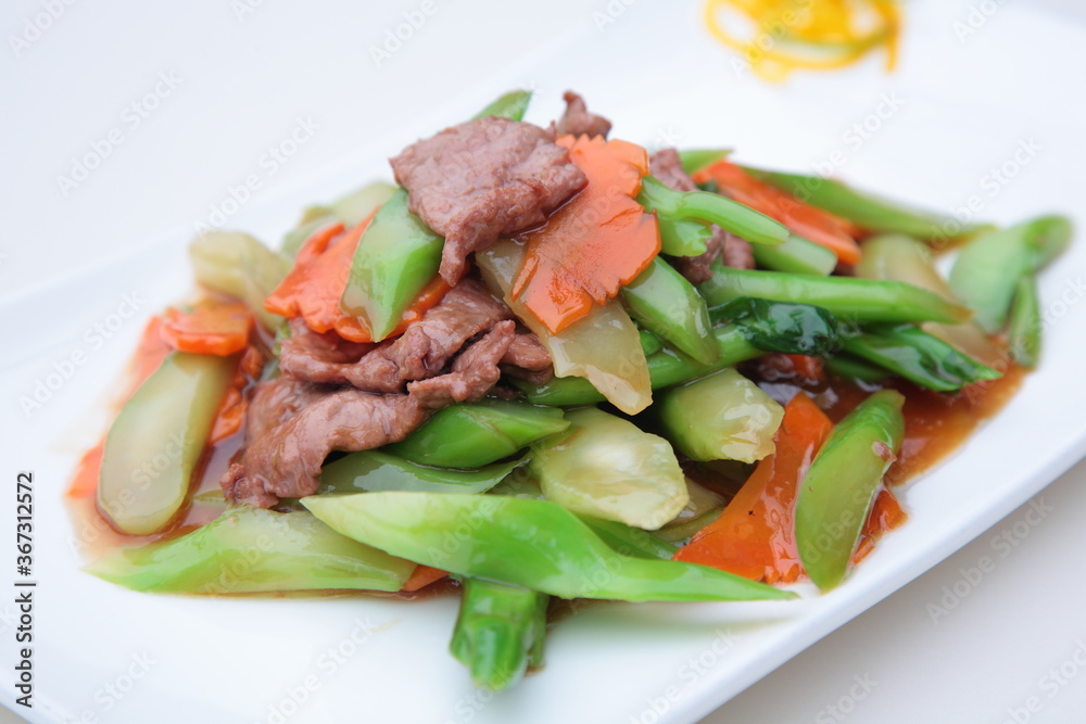 Close up view of Hong Kong and Cantonese style cuisine Chinese kale fried beef Close up view of Hong Kong and Cantonese style cuisine Chinese kale fried beef