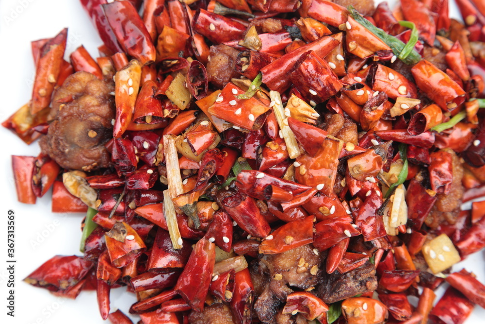 Close up of popular Chinese Sichuan province Cuisine Chongqing style fried chicken with hot chilli Close up of popular Chinese Sichuan province Cuisine Chongqing style fried chicken with hot chilli