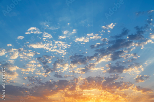 Beautiful colorful sunset sky with orange clouds. Nature sky background. Dramatic sunset.