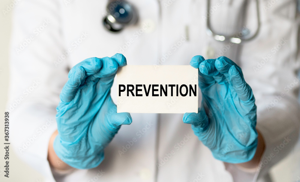 Text Prevention on white card in doctor's hands Text Prevention on white card in doctor's hands