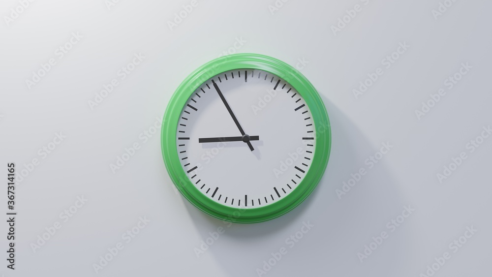 Glossy green clock on a white wall at five to nine. Time is 08:55 or 20:55