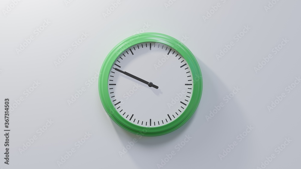 Glossy green clock on a white wall at forty-nine past nine. Time is 09:49 or 21:49 Glossy green clock on a white wall at forty-nine past nine. Time is 09:49 or 21:49