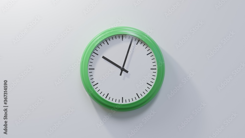 Glossy green clock on a white wall at three past ten. Time is 10:03 or 22:03 Glossy green clock on a white wall at three past ten. Time is 10:03 or 22:03
