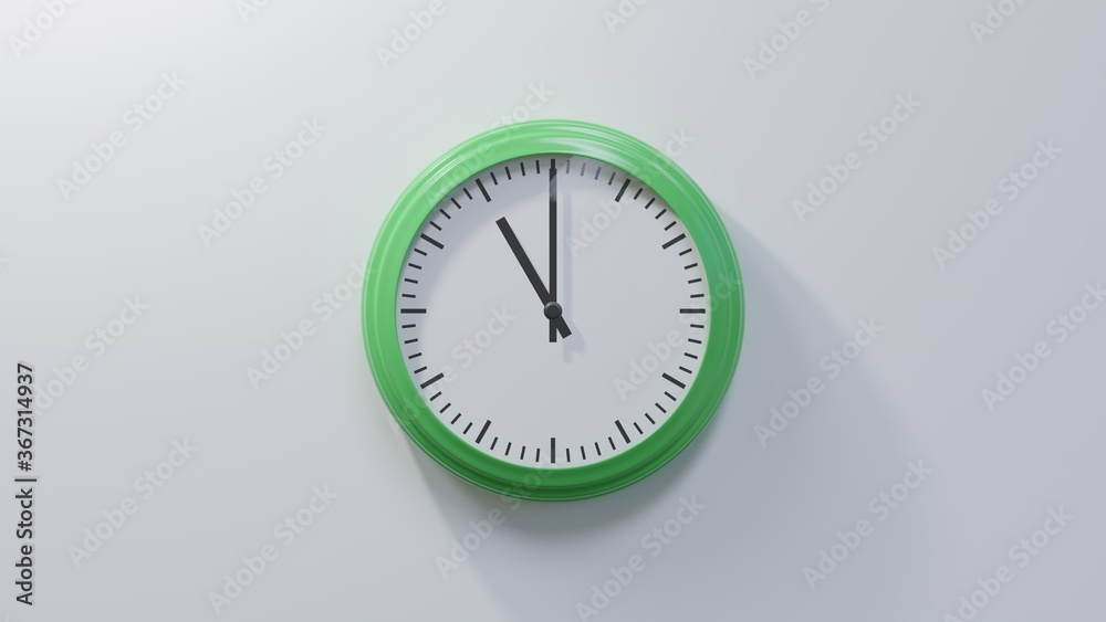 Glossy green clock on a white wall at eleven o'clock. Time is 11:00 or 23:00 Glossy green clock on a white wall at eleven o'clock. Time is 11:00 or 23:00