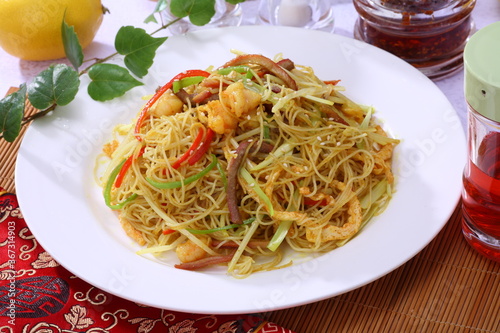 Close up view of Singapore fried rice vermicelli with shrimp, BBQ pork, pepper and curry sauce