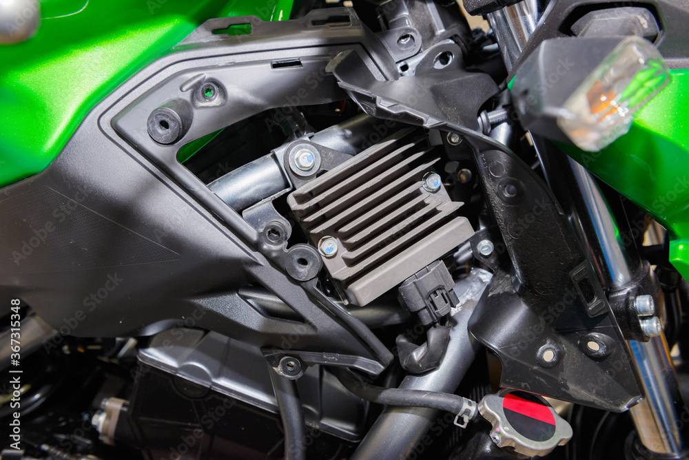 The master performs maintenance on the motorcycle. The master performs maintenance on the motorcycle.