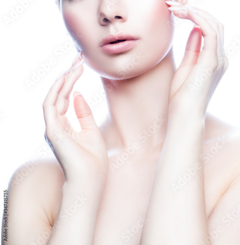 Partial beauty portrait of young woman with perfect skin, hands near cheek. Spa skincare facial treatment health concept