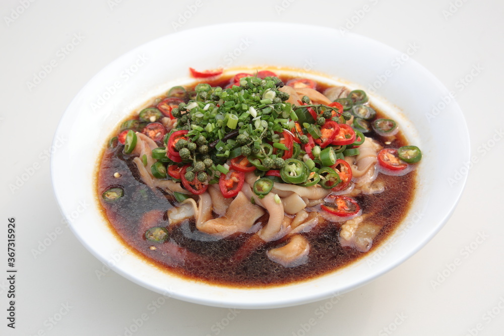 Close up of a typical Chinese Sichuan province cuisine Duck intestines with hot chili sauce Close up of a typical Chinese Sichuan province cuisine Duck intestines with hot chili sauce
