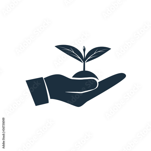 Planting sapling black icon. Male farmer, gardener holding green sprout in hand. Care and environmental development. Ecology concept.Vector illustration flat design. Isolated on white background.