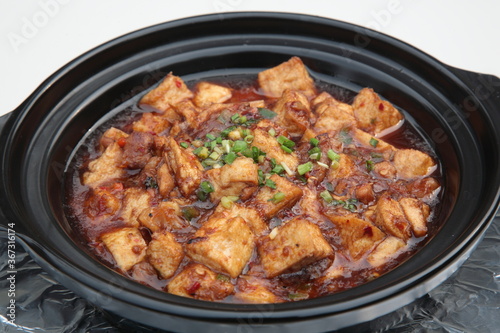 Close up of a typical Cantonese and Hong Kong cuisine Braised diced chicken, salted fish, and Tofu Clay Pot