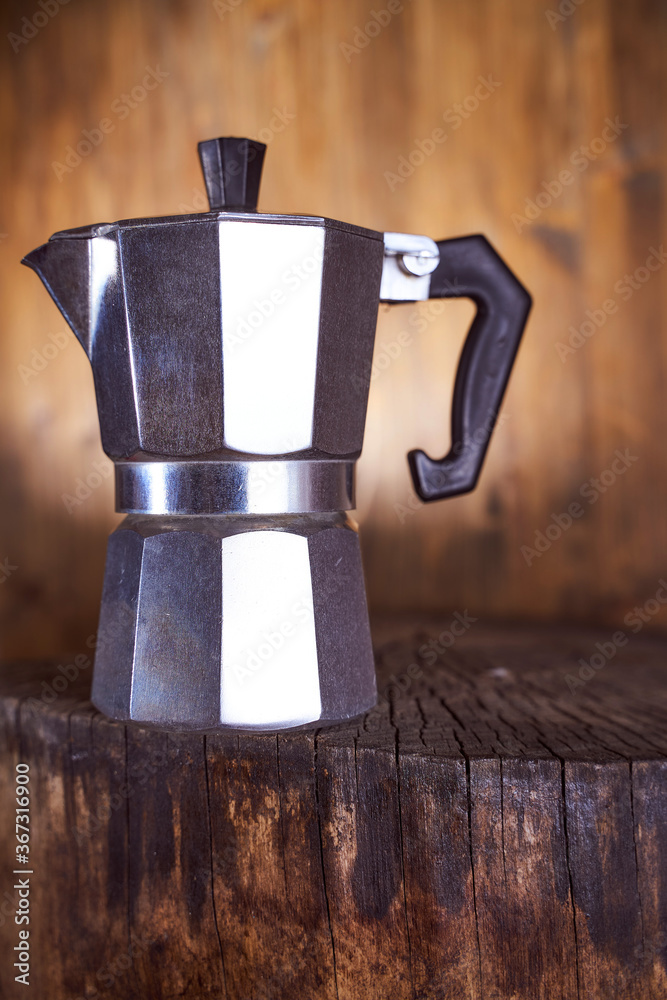 Geyser coffee maker stand on a wooden frame. With copy space. Geyser coffee maker stand on a wooden frame. With copy space.