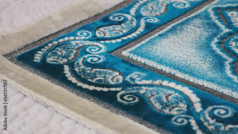 prayer rug, prayer rug and islam, laid out for worship in the room of a house, prayer rug and prayer beads to worship