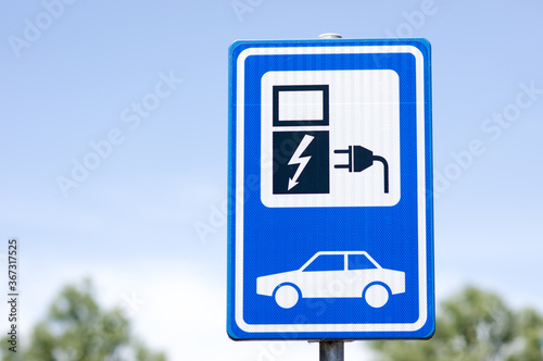 Blue parking sign board for electric car charging in Arnhem, Netherlands
