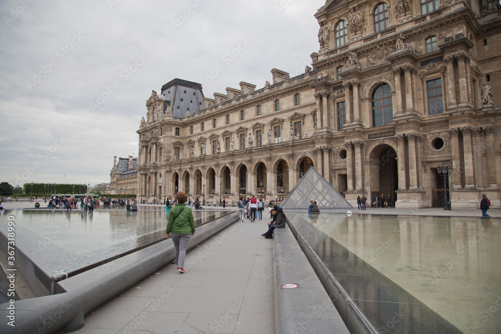 Paris,France-2.June,2014:Tourist walk around the Louvre in Paris, France.