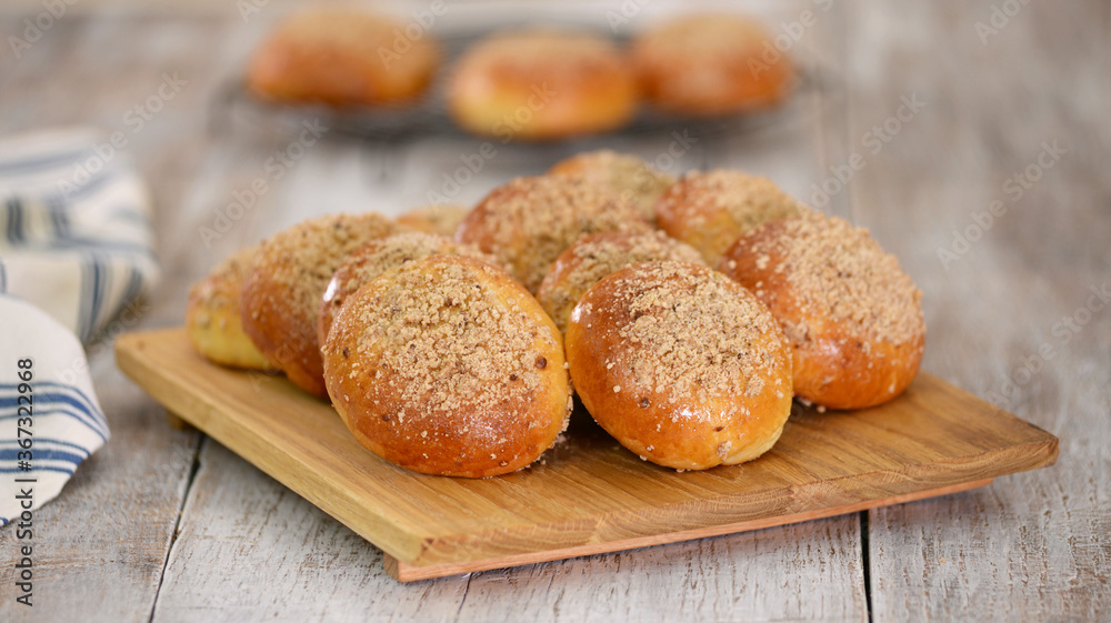 Homemade yeast buns with crumble. Sweet bread.
