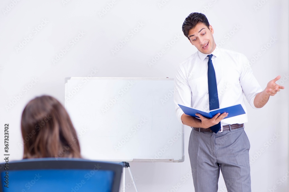 Business presentation in the office with man and woman
