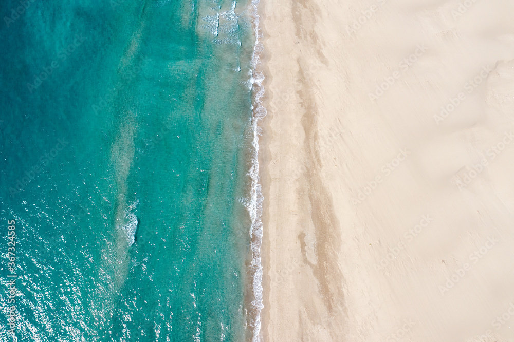 Aerial view of turquoise sea waves and sandy beach in Kas Patara, Antalya, Turkey,