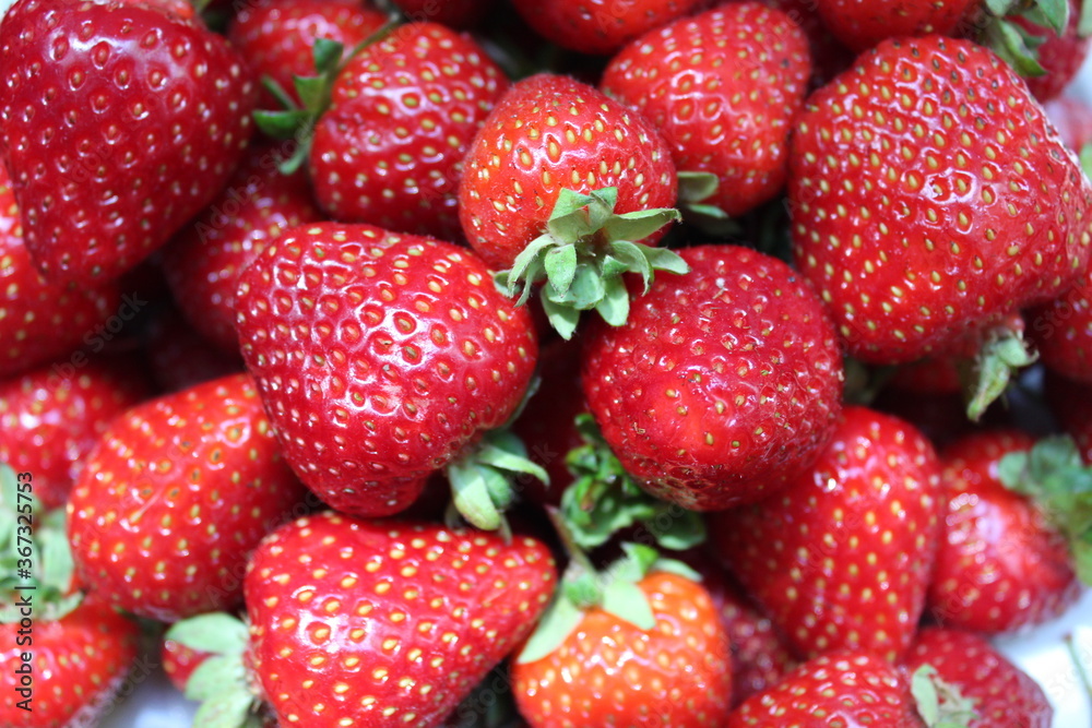 Summer, fresh strawberries on a berries background Summer, fresh strawberries on a berries background
