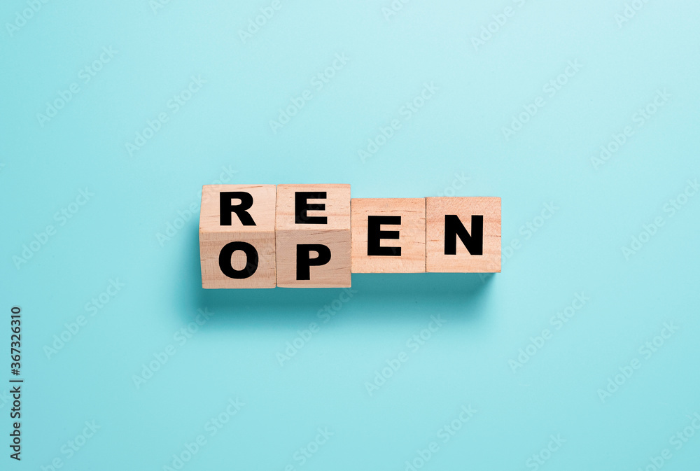 Reopen wording parting screen on wooden cubes block. Shopping mall and restaurants open again after COVID 19. Reopen wording parting screen on wooden cubes block. Shopping mall and restaurants open again after COVID 19.