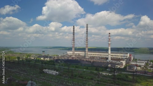 Thermal power plant on the background of an artificial reservoir. Video from the drone. Electricity generation from fossil fuels. Combustion of coal and fuel oil. Burshtyn Ukraine. photo