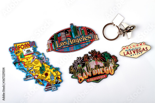 Tourist souvenirs of the USA cities. Trinket magnets of California, San Diego, Los Angeles and Las Vegas. Isolated on white background.