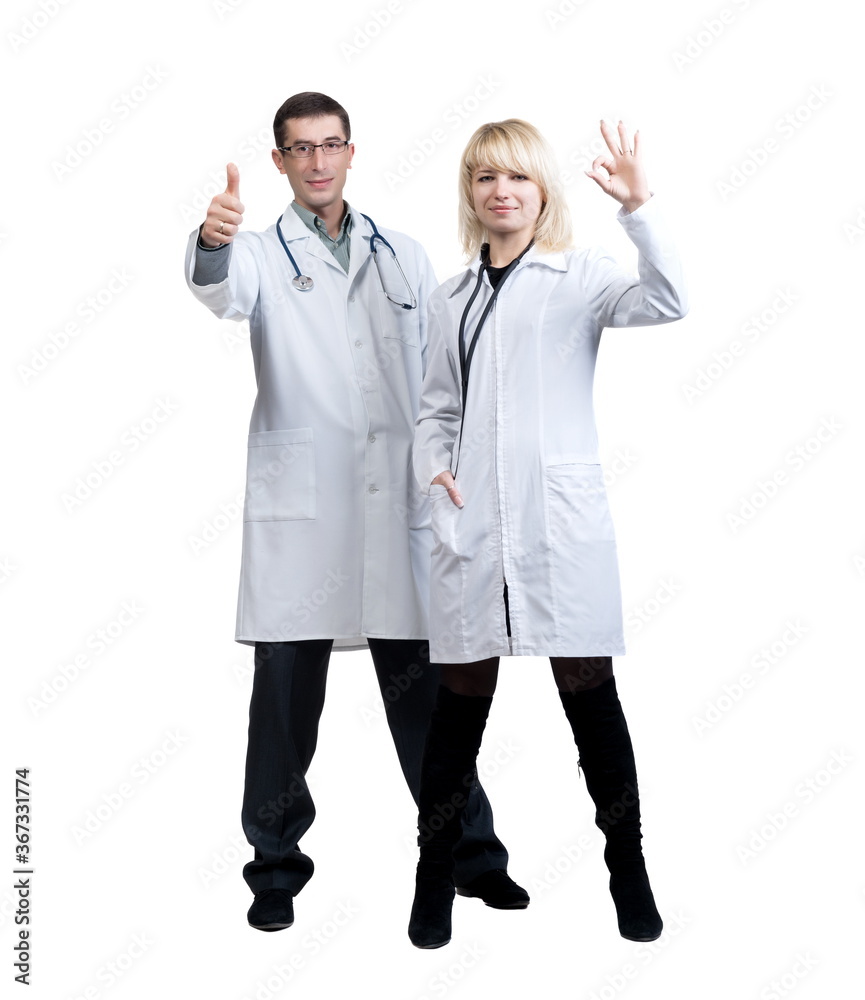 Man and woman in white coats of doctors with stethoscopes on a white background in isolation Man and woman in white coats of doctors with stethoscopes on a white background in isolation