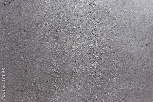 Gray soft metal surface as a background. Texture gray and solid color background with unique and beautiful grunge textures.