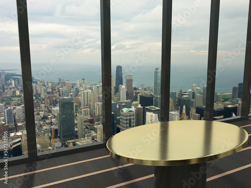 Ausblick auf die Innenstadt von Chicago durch eine Fenster mit davorstehenden Tisch für Mockups und Produktvorstellungen photo