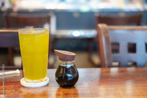 Iced green tea on wood table at Japan restaurant